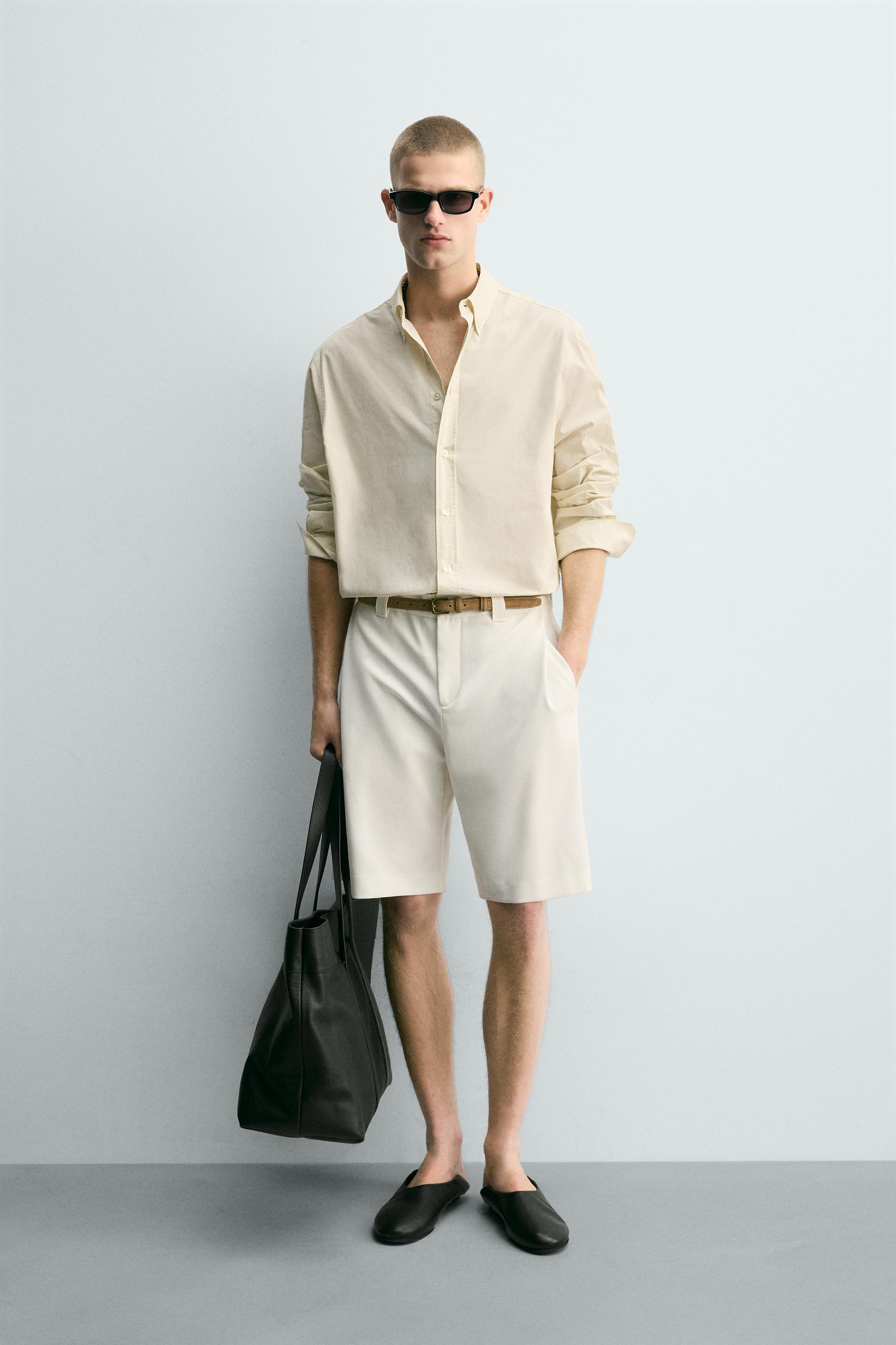 BERMUDA RELAXED FIT PLIS LATÉRAUX